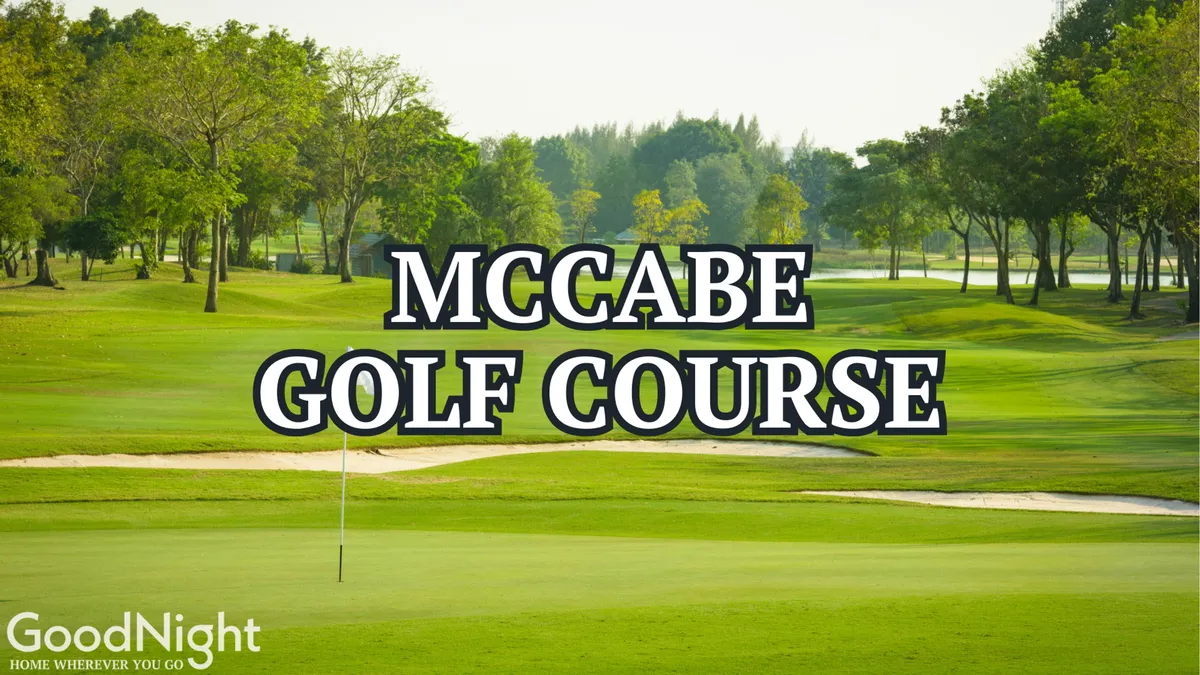 A sweeping view of the golf course green, with a golf flag in the foreground and lush trees and blue sky in the background. Golfers can be seen enjoying a round, emphasizing the recreational and social atmosphere.
